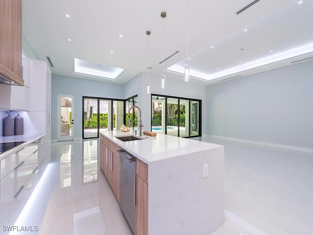 kitchen with a spacious island, hanging light fixtures, stainless steel dishwasher, modern cabinets, and a raised ceiling