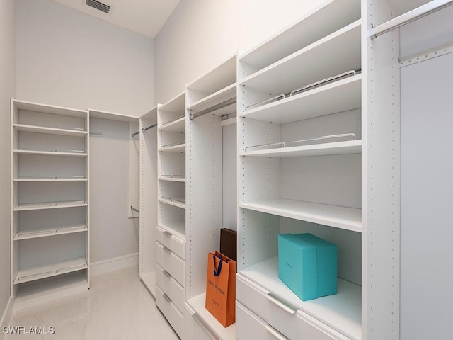 walk in closet with visible vents