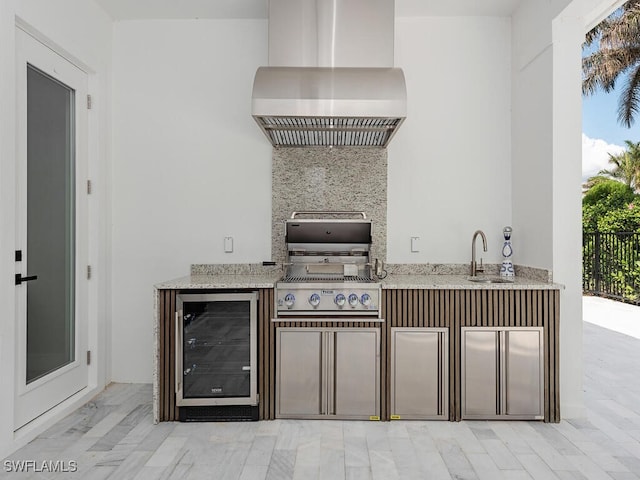 view of patio featuring wine cooler, a sink, grilling area, and area for grilling