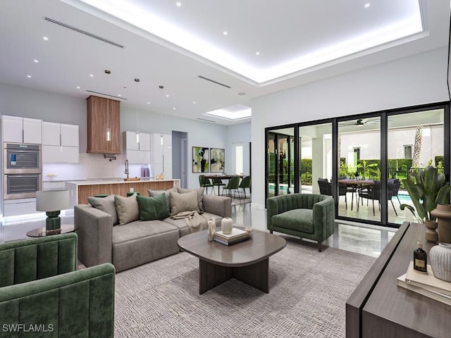 living room featuring a tray ceiling, a towering ceiling, and recessed lighting