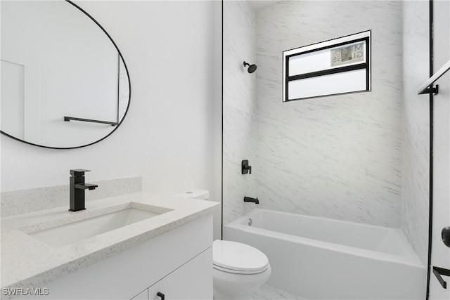 full bathroom featuring tiled shower / bath combo, vanity, and toilet