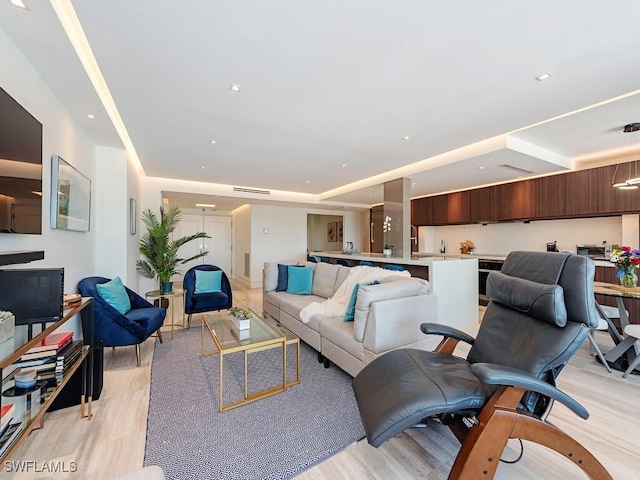 living room featuring recessed lighting and light wood finished floors