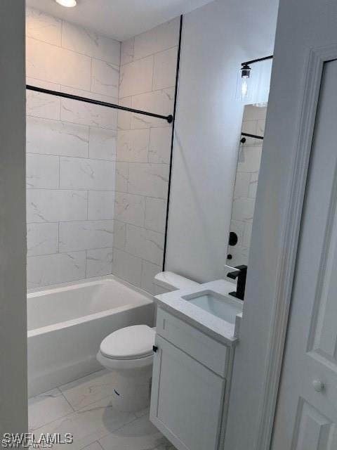 full bathroom featuring tiled shower / bath combo, vanity, and toilet