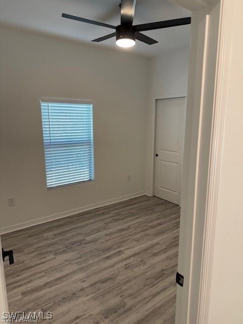 unfurnished room with hardwood / wood-style floors and ceiling fan