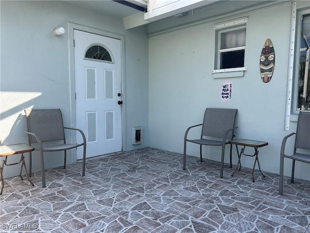 entrance to property with a patio