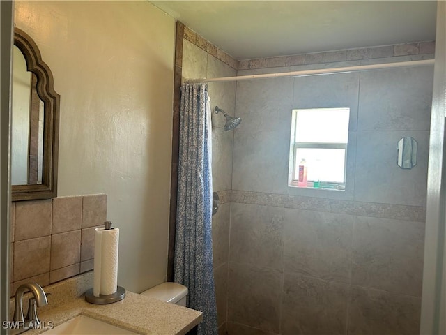 bathroom with vanity, toilet, and a shower with curtain