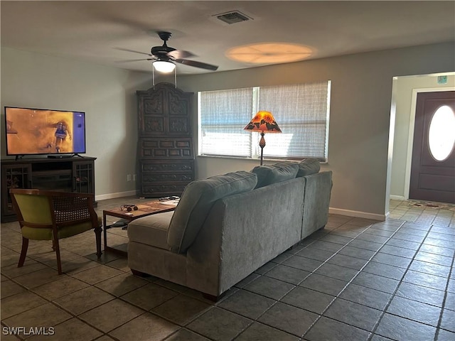 tiled living room featuring ceiling fan