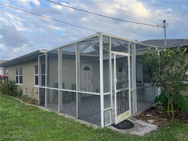 view of outdoor structure featuring a lawn