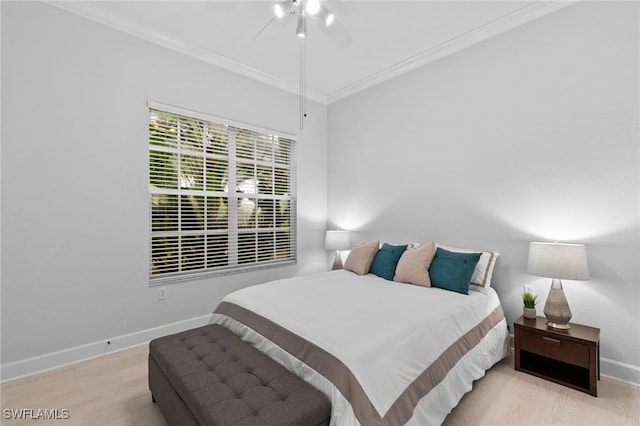 bedroom featuring crown molding, ceiling fan, and light wood-type flooring