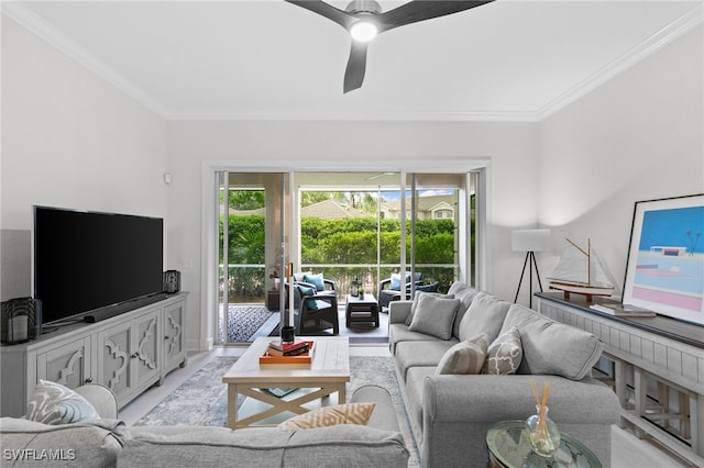 living room with crown molding and ceiling fan