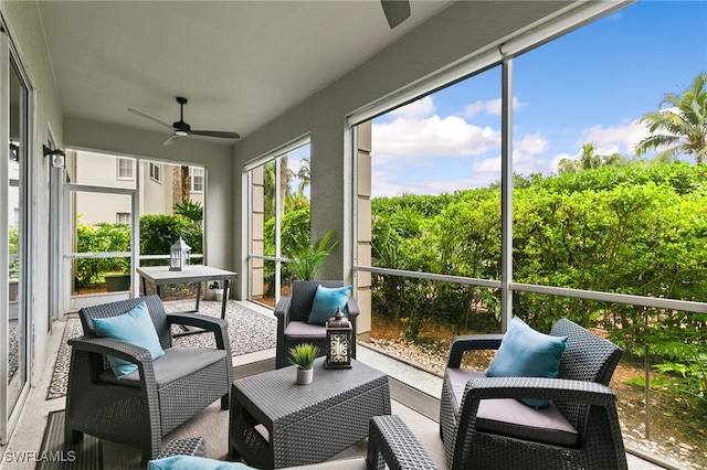 sunroom with ceiling fan