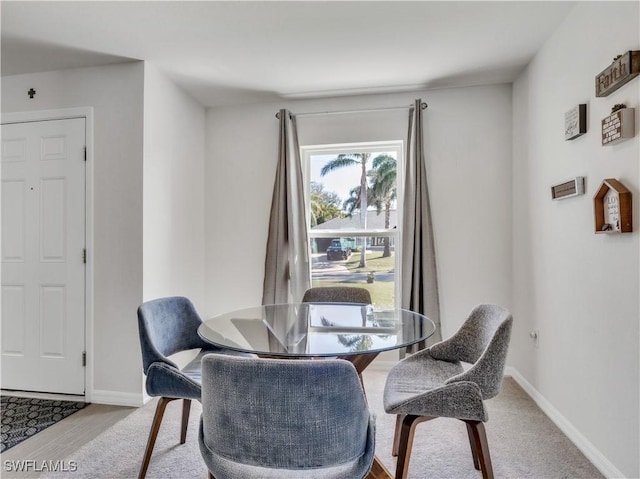 dining room with wood finished floors and baseboards