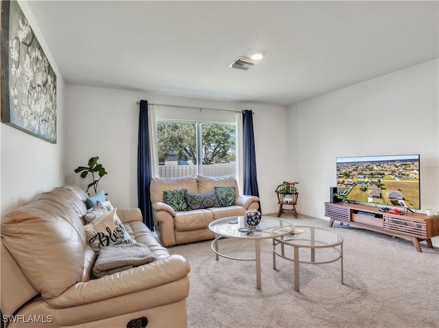 living area with carpet and visible vents