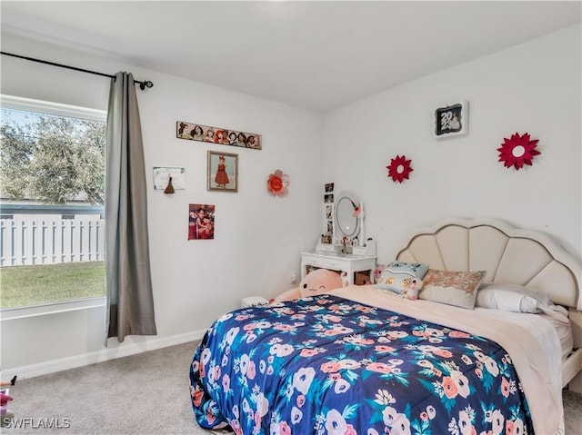 bedroom with baseboards and carpet flooring