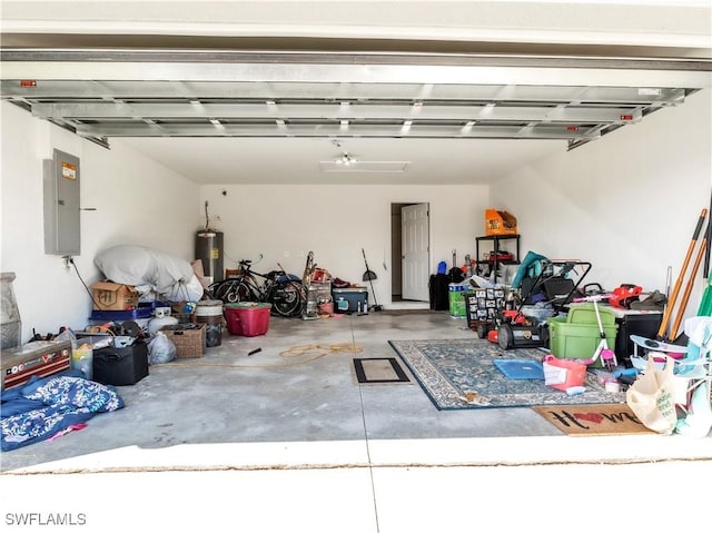 garage with water heater and electric panel