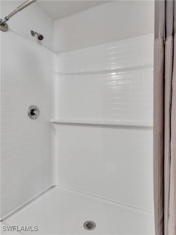 bathroom with a shower with curtain