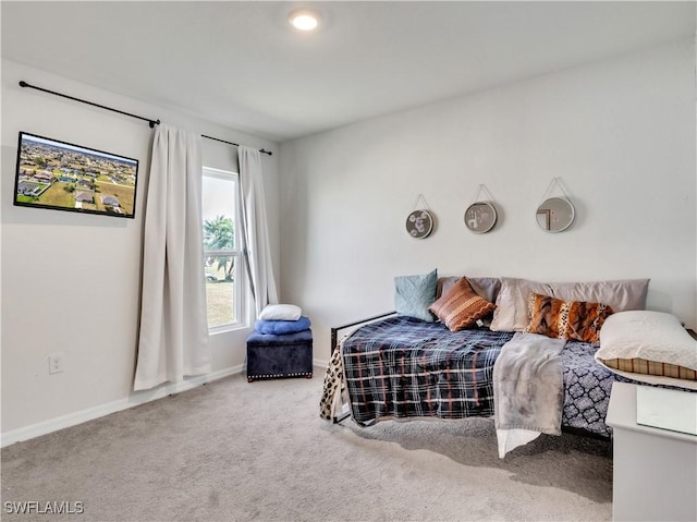 carpeted bedroom with baseboards