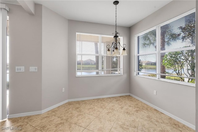 unfurnished dining area with an inviting chandelier, plenty of natural light, and light tile patterned flooring