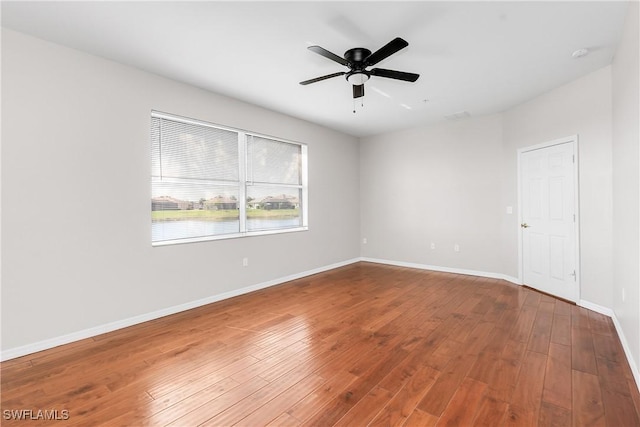 unfurnished room with hardwood / wood-style flooring and ceiling fan