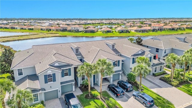 birds eye view of property with a water view