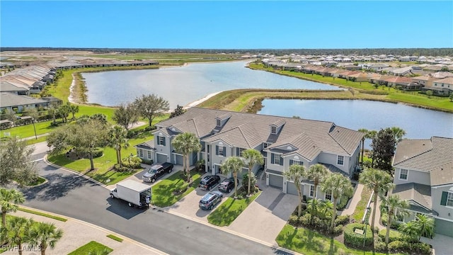 drone / aerial view with a water view