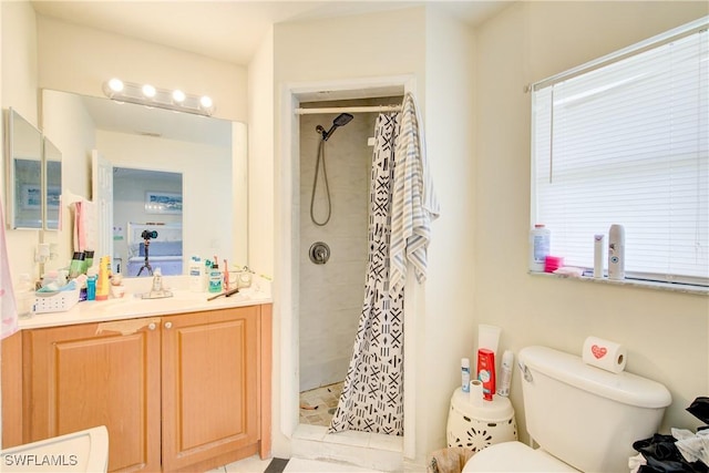 bathroom with vanity, a shower with curtain, and toilet