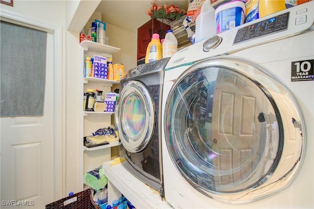 washroom featuring washer and dryer