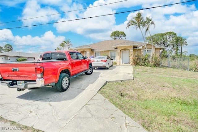 ranch-style house with a front lawn