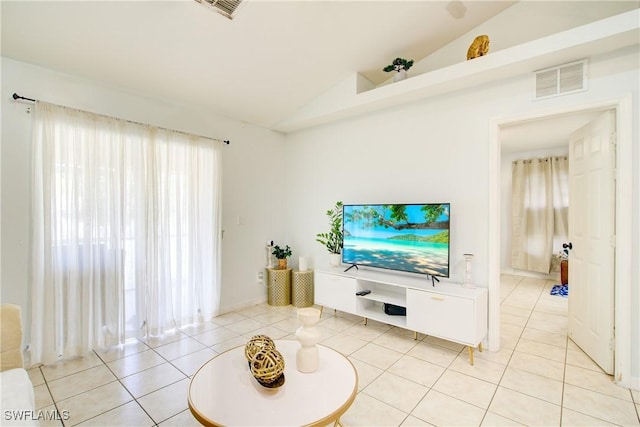 tiled living room featuring lofted ceiling