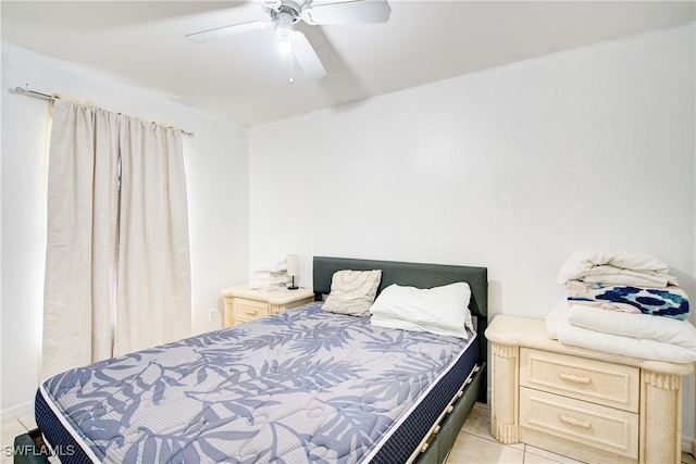 bedroom featuring light tile patterned floors and ceiling fan