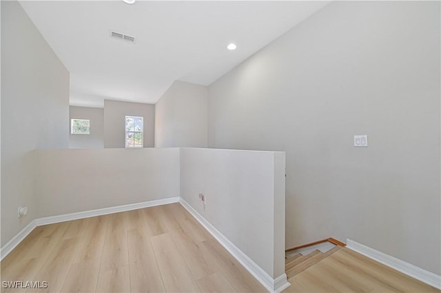 unfurnished room with light wood-type flooring