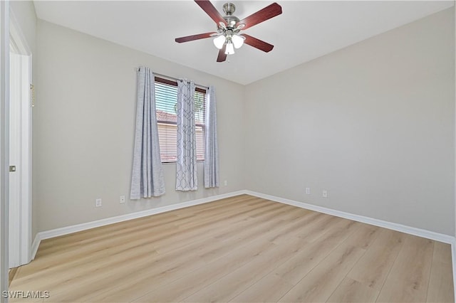 empty room featuring light hardwood / wood-style flooring and ceiling fan