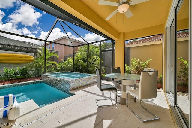 view of swimming pool featuring an in ground hot tub, a lanai, and a patio