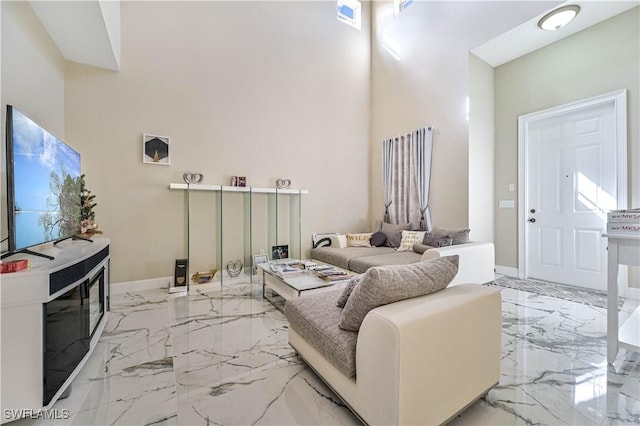 living room with a high ceiling