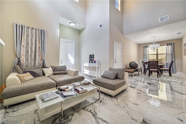 living room with a notable chandelier