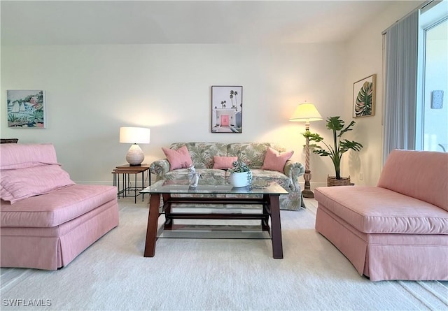 living area with light carpet