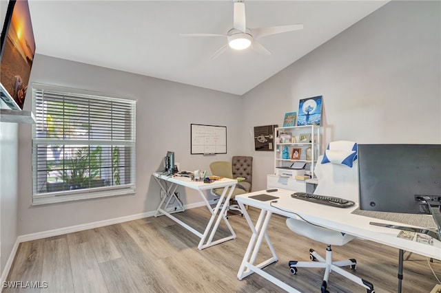 office area featuring vaulted ceiling, hardwood / wood-style floors, and ceiling fan