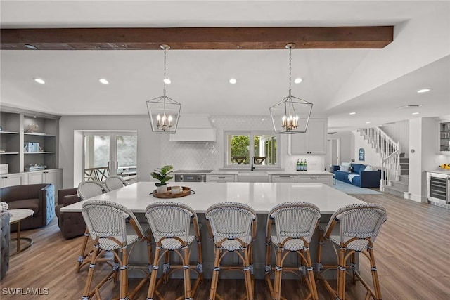 4611 Crayton Rd, Naples, FL 34103 - kitchen with open floor plan, a chandelier, a sink, and recessed lighting