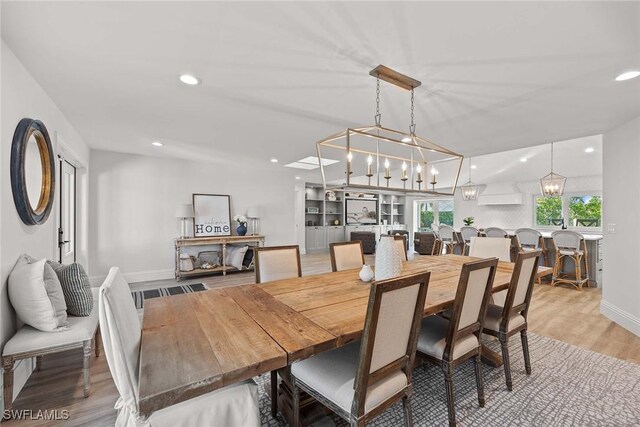 4611 Crayton Rd, Naples, FL 34103 - dining area featuring a chandelier, light wood-style floors, recessed lighting, and baseboards