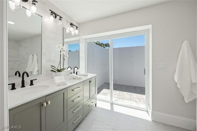 4611 Crayton Rd, Naples, FL 34103 - full bathroom featuring double vanity and tile patterned flooring