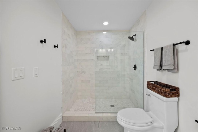 4611 Crayton Rd, Naples, FL 34103 - bathroom featuring toilet, tiled shower, and recessed lighting