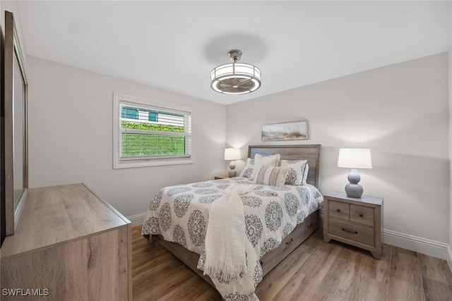4611 Crayton Rd, Naples, FL 34103 - bedroom featuring baseboards and wood finished floors