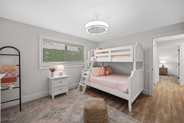 4611 Crayton Rd, Naples, FL 34103 - bedroom with light wood-type flooring and baseboards