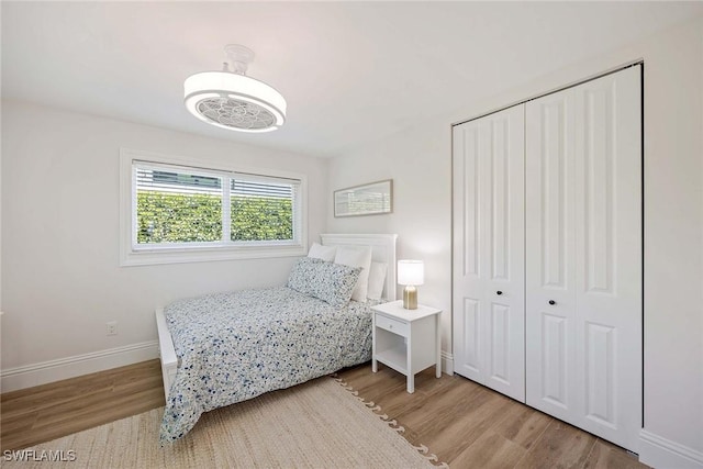 4611 Crayton Rd, Naples, FL 34103 - bedroom featuring light wood-type flooring, baseboards, and a closet