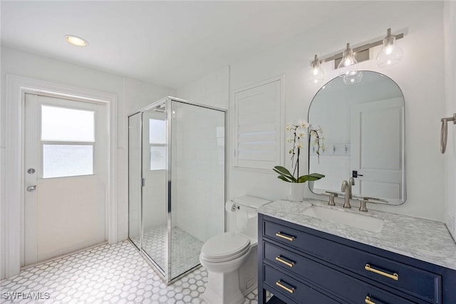 4611 Crayton Rd, Naples, FL 34103 - bathroom featuring a shower stall, vanity, and toilet