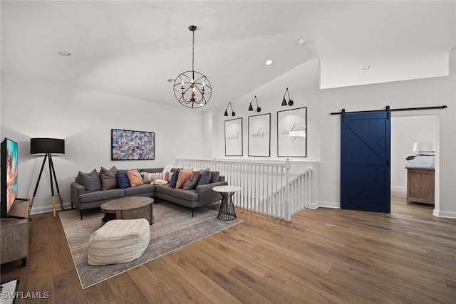4611 Crayton Rd, Naples, FL 34103 - living area with hardwood / wood-style flooring, a chandelier, a barn door, baseboards, and vaulted ceiling