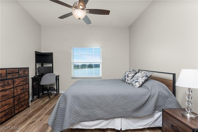 bedroom featuring a ceiling fan and wood finished floors