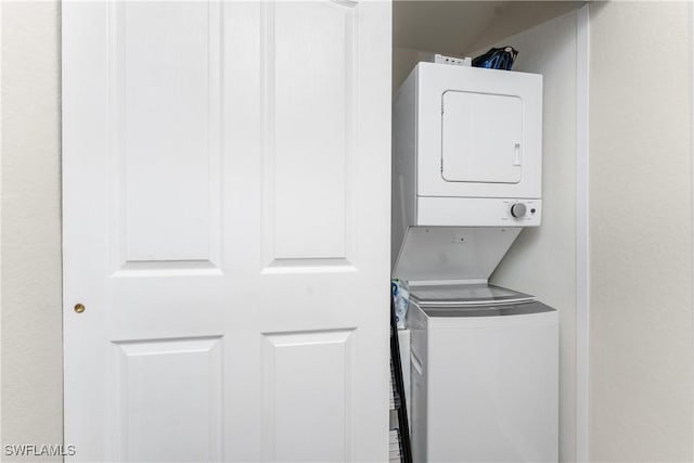 laundry room with laundry area and stacked washer / drying machine