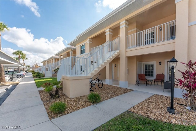 surrounding community with a patio and stairs