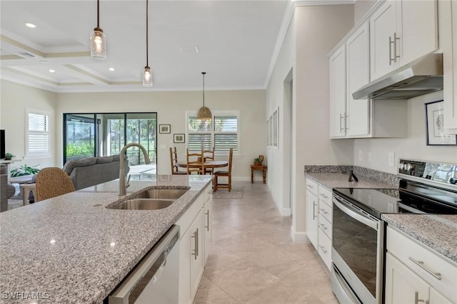 kitchen with white cabinetry, sink, hanging light fixtures, light stone counters, and stainless steel appliances